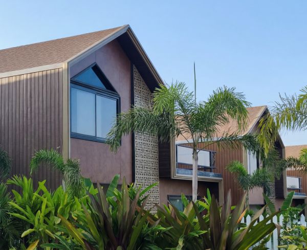 4 BHK villas — contemporary gabled exteriors with tropical landscaping at Beverly Hills